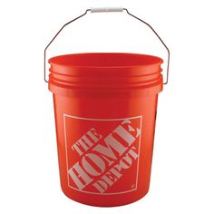 a red bucket with the words home depot on it