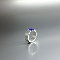 "Modern band ring Lapis Lazuli and Sterling silver inlay. Unique gift for her, girlfriend, friend, wife, mom, September and October birthstone, 8 year anniversary. Beautiful ring with a design of simplicity and modern elegance. The stone is set in the middle of the Sterling silver band. This beautiful ring is worked with the technique of inlay, which means the stone is worked seamlessly into the Sterling silver. All our stones are natural stones and our jewelry is handmade, slight differences in Blue Round Band Jewelry Gift, Modern Round Sapphire Ring As Gift, Modern Sapphire Ring With Round Band, Modern Sapphire Ring Gift, Blue Sterling Silver Round Band Jewelry, Modern Sterling Silver Sapphire Ring As A Gift, Modern Open Band Rings For Gifts, Silver Jewelry For Promise Ring With Polished Edges, Modern Blue Sapphire Ring With Round Band