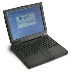 an open laptop computer sitting on top of a white surface