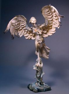 a statue of an angel with outstretched wings