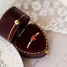 an open ring box sitting on top of a table