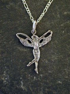 "This fairy pendant is Sterling Silver, The included chain is a Sterling Silver Figaro 50 chain. You may chose 16, 18 or 20 inch at the same price. Other length available at sightly higher prices. The Fairy measures 1 1/8\" tall by 15/16\" across. I hand cast all my pieces using the lost wax casting method. Please ask your needs. You may call me with questions, often I am out so please use my machine. 831-476-3176. Satisfaction Guaranteed! I send items USPS First Class unless otherwise directed. Silver Fairy Grunge Necklace As A Gift, Silver Fairy Grunge Necklace For Gift, Silver Fairy, Fairy Pendant, Wax Casting, Lost Wax Casting, Hand Cast, Lost Wax, The Fairy