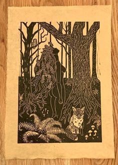 a wood block with an image of a forest scene and two foxes in the woods