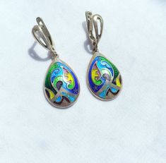 Georgian cloisonne enamel earrings, minimalist, teardrop earrings - Fine silver jewelry This jewelry is 100 % handmade by me in my studio. The technique is called Cloisonne enamel which is well known in Georgia. Many people in my country love buying handmade jewelry because they are unique and special!  ▪️ ▪️ ▪️ About shipping▪️ ▪️ ▪️ The price for this item includes standard shipping cost. Estimated arrival time: 3-4 weeks. ▪️ Delays might occur due to the current situation worldwide. So, pleas Silver Teardrop Earrings With Artistic Design, Sterling Silver Teardrop Jewelry With Artistic Design, Multicolor Teardrop Enamel Jewelry, Multicolor Enamel Teardrop Jewelry, Enamel Teardrop Jewelry With Matching Earrings, Elegant Hand Painted Silver Earrings, Teardrop Enamel Earrings For Gifts, Silver Enamel Teardrop Jewelry, Artisan Teardrop Earrings With Artistic Design