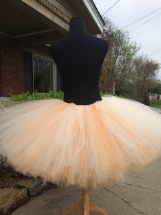 "This listing features an ivory, beige and peach tutu please select the length range that you would desire and make a note in the note to seller section of the length you would like to go with. Our last picture shows our silver tutu being modeled this is not the color you will receive it's just to show how it looks on. Tutu pictured in the first four photos is a 17\" tutu. Thank you for shopping with Princess Tutus Boutique. If you have any questions please feel free to convo us at anytime and w Cream Ruffled Tutu Dress For Party, Fitted Cream Petticoat For Wedding, Cream Tulle Tutu Dress For Wedding, Cream Tulle Tutu Dress For Bridesmaids, Fitted Cream Tutu Dress With Tulle Skirt, Cream Tutu Dress For Pageant, Cream Tulle Tutu Bridesmaid Dress, Cream Fitted Wedding Petticoat, Cream Tulle Bridesmaid Tutu Dress