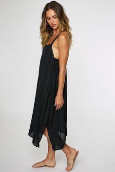 Essential midi cover-up dress that has a solid color design, self-adjusting straps and flowy fit. O'Neill Women's midi cover-up dress 37 3/4" In length Self adjusting straps Flowy fit Center back seam Solid color wash 100% Viscose Black Sleeveless Maxi Dress With Tie Straps, Sleeveless Black Maxi Dress With Tie Straps, Solid Color Slip Dress With Adjustable Straps For Spring, Slip Dress With Adjustable Straps For Vacation, Solid Slip Dress With Adjustable Straps For Spring, Black Spaghetti Strap Dress For Beach Season, Spaghetti Strap Slip Dress For Beach, Chic Solid Color Slip Dress For The Beach, Casual Black Maxi Dress With Adjustable Straps