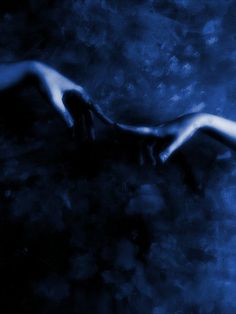 two hands reaching towards each other in front of a dark blue background with black and white swirls