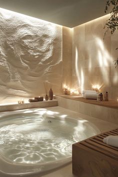 a large jacuzzi tub with candles on the wall