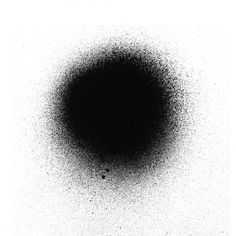 black and white photograph of an object in the middle of the sky with dots on it