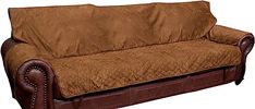 a couch with a brown cover sitting on top of it's armrests