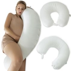 a woman laying on top of an inflatable pillow next to two white pillows