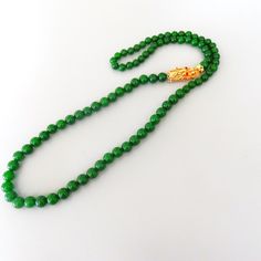 Green Jade 32 Long Necklace Gold Vermeil 925 Sterling Dragon Clasp With Red Crystal Eyes - Etsy Elegant Green Necklace With Sterling Silver Clasp, Classic Jade Gemstone Beads Jewelry, Classic Single Strand Emerald Necklace Gift, Classic Green Gemstone Beads Necklace, Formal Single Strand Jade Jewelry, Formal Single-strand Jade Jewelry, Classic Green Single Strand Necklace, Long Necklace Gold, Crystal Eyes