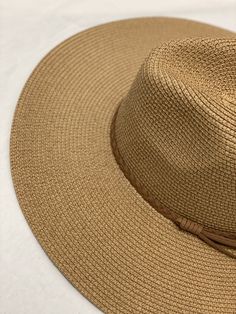 Braided rope strap floppy sun hat. Color: Tan One size fits most Chic Adjustable Bucket Hat For The Beach, Chic Adjustable Bucket Hat For Beach, Chic Solid Color Fedora Sun Hat, Trendy Adjustable Brown Sun Hat, Chic Adjustable Outdoor Hats, Chic Adjustable Outdoor Hat, Lightweight Brown Summer Fedora, Summer Lightweight Brown Fedora, Adjustable Brown Hat Bands For Summer