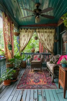 the porch is covered with curtains and furniture, including a couch on an ornate rug