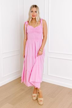 - Stroll through summer in this beautiful midi! With its adorable smocked bodice and sweet tied straps, it's an adorable piece of sunny style. Perfect for picnics, parties, or just feeling fabulous any day of the week! - Lightweight material - A built-in skirt lining - A sweetheart neckline with ruched detail - A smocked bodice - 1-inch tied straps - Functional side pockets - Flowy yet flattering silhouette that ends in a midi length hemline Vacation Smocked Midi Dress With Tie Straps, Summer Smocked Midi Dress With Tie Straps, Vacation Midi Smocked Dress With Tie Straps, Sleeveless Smocked Dress With Tie Straps For Summer, Summer Beach Smocked Dress With Adjustable Straps, Summer Smocked Dress With Tie Straps For Day Out, Spring Beach Smocked Dress With Adjustable Straps, Summer Smocked Dress With Spaghetti Straps For Day Out, Spring Sundress With Smocked Tie Straps