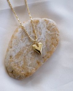 Show your love with this gorgeous Puffy Heart Necklace! Crafted in luxurious gold, this eye-catching necklace adds the perfect touch of romance to your look. For a heartfelt gift or an expression of your own affection, you can't go wrong with this stunning piece! NECKLACE FEATURES Material: Brass 24K Gold Filled Chain Width: Approx. 1.5mm Chain Style: Barleycorn Designed Chain Lead Free, Nickel Free Puffy Heart Necklace, Dainty Heart Necklace, Friendship Necklace, Necklace Love, Friendship Necklaces, Dainty Gold Necklace, Chain Extenders, Puffy Heart, Jewelry Card