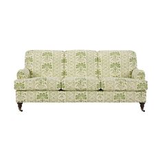 a green and white couch on a white background