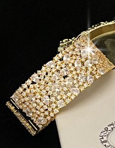 BELLA-TIARA'S BRIDAL ROYAL JEWELRY COLLECTION A BELLA-TIARA'S FAVORITEGorgeous, elegant and glamorous wide Swarovski crystal cuff bracelet. Design with crystal all around the perfect fit approx 2.5" wide and 7" round suitable for smaller to average wrist. *Note processing time is not shipping time, our regular Free shipping takes approx. 5-6 days to receive after shipped. With rush processing your order is expedited and you will also be upgraded to priority mail approx 2-3 days to arrive once sh Crystal Cuff Bracelet, Gold Cuff Bracelet, Gold Bracelet Cuff, Gold Cuffs, Bracelet Design, Royal Jewelry, Bridal Tiara, Swarovski Crystal, Priority Mail