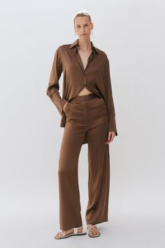 A trouser made of 100% silk. The wide leg floaty trousers features a fly opening, tailored waist band & side entry pockets and pressed centre fronts. Silk Trousers, Brown Silk, French Seam, Poplin Shirt, Mother Of Pearl Buttons, Pearl Buttons, Navy Stripes, Tailored Trousers, Silk Shirt