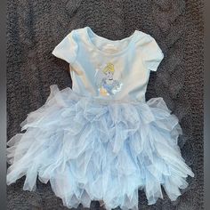 Beautiful Silky Blue Cinderella Dress With Tulle. Top Of The Dress Is Super Soft And Stretchy, Contrast Silver Glitter Band Where Tulle Starts. Really Full Tulle Skirt With Silky Liner Plus Attached Bodysuit Underneath. Nwot Size 2t Light Blue Princess Style Tutu Dress For Dress-up, Blue Princess Dress With Short Sleeves For Dress-up, Blue Short Sleeve Princess Dress For Dress-up, Disney Princess Dress For Dress-up, Cute Blue Princess Dress With Short Sleeves, Short Sleeve Princess Dress For Dress-up, Princess Style Short Sleeve Dress-up Dress, Blue Short Sleeve Cute Princess Dress, Blue Ruffled Twirl Dress For Dress-up