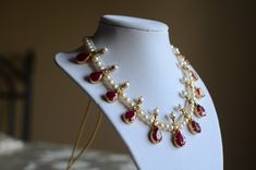 The most unique of all designs we have, large semi-precious rubies, joined together with pearls. Luxury Round Beads Necklaces For Puja, Luxury Temple Jewelry Pearl Necklace With Round Beads, Luxury Traditional Pearl Pendant Temple Necklace, Luxury Ruby Chandbalis In Temple Jewelry Style, Strixhaven Dnd, Desi Jewellery, Desi Jewelry, Simple Jewellery, Handmade Boho Jewelry