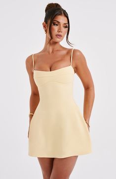 Keep it fun and flirty in the Dakota dress. everyone's fave mini of the season. Made in our lightweight stretch crepe. this figure-hugging design snatches in at the waist and flares into an A-line skirt. The neckline has a slight sweetheart shape with seam detail. while the straps are adjustable for your perfect fit.   Colour: Lemon. Premium stretch crepe fabric. Fully lined. Slight sweetheart neckline. Seam detail on bust. Shaped underbust. A-line shape skirt. Adjustable straps. Invisible zipper to reverse. Mini length. Model is an XS and is wearing an XS. Homecoming Dresses Corset, Midi Dress Wedding Guest, Maxi Dress Sale, Lemon Dress, Sparkle Dress, Mini Dresses For Women, Stretch Crepe, Dresses By Length, Formal Dresses Prom