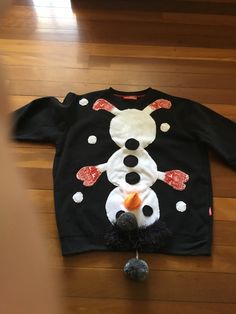 Men's black funny Christmas sweater. Funny Christmas sweater.  Snowman on the front. 'Tickles my baubles' on the back The design and work is all done by me. Measurements  Fits AU XL Chest 126cm  49.5 inches Sleeves 50cm 19.5 inches Length from shoulder to hem 68 cm  27 inches Fits size XL Please check the measurements against your own sweaters for the best fit. I post worldwide except for Germany. Thank you for your understanding. International Orders: import duties, taxes and charges are not in Black Holiday Sweater For Winter, Black Crew Neck Top For Holiday, Funny Black Winter Sweatshirt, Black Tops For Winter Holiday, Black Tops For Holiday In Winter, Funny Winter Tops In Black, Funny Black Top For Winter, Funny Black Winter Tops, Black Long Sleeve Sweatshirt For Holiday