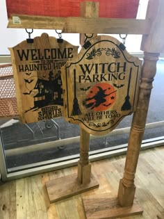 a wooden sign that says welcome to the witch parking lot in front of a window