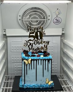 a birthday cake is sitting in the refrigerator