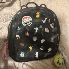 Custom Kawaii Pin Bag, Black Mini-Backpack With Cat Ears, Bag Is Brand New, Never Used, With Clear Vinyl Window On Front To Display Pinsi Hand Selected Pins For This Bag, As Well As Sanrio Zipper Pull, Cute Kawaii Kiwi Clip, And Fuzzy Bunny Id Holdermost Pins Are Enamel Pins, 2 Button Pins, Room To Add More From Your Own Collection! Kawaii Mobile Phone Satchel Bag, Multicolor Harajuku Standard Backpack, Black Harajuku Style Everyday Backpack, Kawaii Shoulder Bag With Detachable Strap, Kawaii Satchel Bag For Daily Use, Kawaii School Pouch Bag, Black Pouch School Bag, Casual Backpack With Cute Design, Black School Bag With Detachable Strap