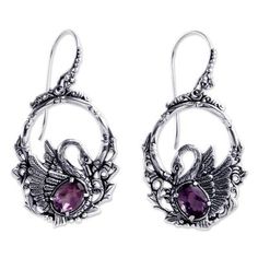 Faceted amethysts sparkle in finely detailed earrings by Kadek Hendra. Depicting graceful swans the ornate design showcases 3 gemstone carats. .925 Sterling silver Ornate Purple Drop Earrings, Ornate Purple Dangle Earrings, Elegant Purple Pierced Hoop Earrings, Ornate Purple Dangle Jewelry, Elegant Purple Gemstone Hoop Earrings, Ornate Purple Pierced Earrings, Ornate Purple Sterling Silver Earrings, Purple Earrings With Intricate Design As Gift, Elegant Purple Amethyst Hoop Earrings