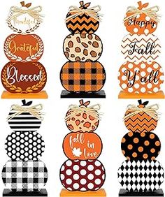 the pumpkins are decorated with black and white checkered paper, which says happy fall