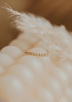 We love this chain ring worn individually for a simple adornment, or stacked for a stronger statement. 1.8mm band width. Available in 14kt Gold Fill. Due to the making process, this ring may run +/- 1/4 size. Paired on Jess with our Confetti Rings and Valley Trio. Handmade in Eau Claire, WI. Our jewelry is handmade so each piece will be unique and may vary slightly from what is pictured. Confetti Rings, Copper Uses, Everyday Wear Jewelry, Cuff Rings, Midi Rings, Ring Sizer, Jewelry Cleaner, Chain Ring, 14kt Gold