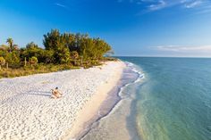 the beach is clean and clear for people to enjoy in it's white sand