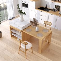 a kitchen table with two chairs and a stove in the back drop off cabinet next to it