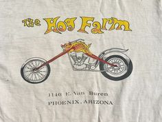 a white t - shirt with the words, the hot farm on it's front