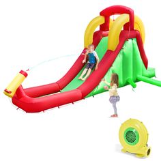 an inflatable water slide with two children playing on it