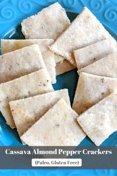 several pieces of crackers on a blue plate with the words cassavaa almond pepper crackers