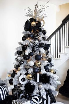 a black and white christmas tree decorated with ornaments