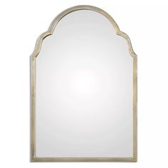 a large mirror with an arch shaped frame