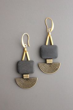 18k gold plated hook earrings with black agate and brass. *Please note new oval version of black agate stone. Modern Black Jewelry With Ear Wire, Elegant Black Brass Jewelry, Modern Black Oval Jewelry, Handmade Modern Onyx Jewelry, Black Brass Earrings With Ear Wire, Black Brass Earrings, Gold Onyx Earrings, Artisan Black Oval Beaded Jewelry, Handmade Black Brass Earrings