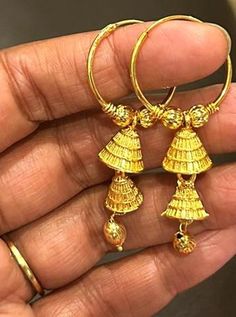 Beautiful pair of gold plated rings withhanging  jhumkis for  a attractive look to compliment your ethnic wear . diameter 1 inch 22k Gold Dangle Jhumkas For Festive Occasions, 22k Gold Chandbali Danglers With Latkans, Gold Jewelry With Matching Earrings For Puja, Gold Jewelry Set With Matching Earrings For Puja, Gold Earrings For Puja, Gold Chandbali Earrings For Puja, Gold Plated Temple Jewelry Danglers For Puja, Gold Plated Latkans Temple Earrings, Gold Plated Latkans Temple Jewelry Earrings