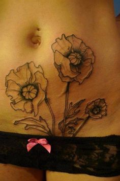 a woman's stomach with flowers on it