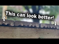 a close up of a wooden fence with an arrow pointing to the right and another sign that says, this can look better