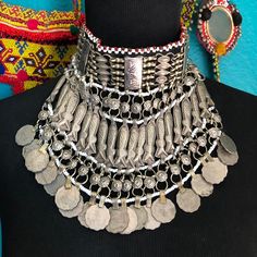 Beautiful Kuchi choker made from silver tone base metal with round coin medallions, seed beads, coins & fish motifs. An excellent addition to any belly dancing outfit. There are 2 metal loops on the back with black cords for wearing & it is lined with black cloth. This piece is in excellent condition. Handmade Adjustable Coin Necklace For Festivals, Bohemian Adjustable Silver Beads Choker, Adjustable Bohemian Choker With Silver Beads, Handmade Metal Coin Necklace For Festival, Bohemian Silver Beaded Choker, Festival Choker With Silver Beads, Ceremonial Adjustable Silver Choker, Silver Coin Necklace For Festival, Silver Coin Jewelry For Festival