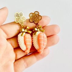 These earrings are for all you sushi lovers out there! There's no such thing as too much sushi, so why not wear these conversation-starting accessories for your day or night out on the town.  ----- SPECIFICATIONS Handmade Item / Made to Order Length: 3.5cm; Width: 1.5cm Materials: Brass, Stainless steel Closure: Stud Color: Orange, Gold Style: Fun, Cute, Kawaii, Whimsical ----- Thank you so much for supporting Flower Bunny - it means a lot to me! I hope you love your new one-of-a-kind goodies as Handmade Adjustable Kawaii Earrings, Cute Pierced Drop Earrings, Cute Drop Earrings For Pierced Ears, Handmade Kawaii Dangle Earrings, Adjustable Kawaii Dangle Earrings, Cute Drop Clip-on Earrings For Gift, Kawaii Drop Earrings, Cute Dangle Clip-on Earrings As Gift, Handmade Novelty Plug Earrings For Gift