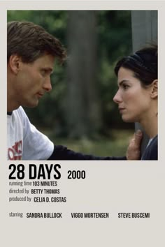 an advertisement for the movie 28 days with two people facing each other and trees in the background