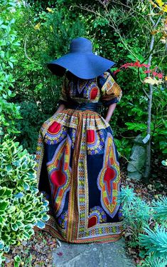 An exquisite black dashiki maxi dress. The smocking at the top gives with the full skirt gives a flattering silhouette. It has full sleeves that can be worn in a puff style or elongated. 100% Cotton Hand made in Ghana. Length 58" appx Care Hand wash in cool water. Drip dry. Dry away from direct sunlight. Iron on medium heat. Black Ankara Fabric Maxi Dress, Black Long Sleeve Dress In Ankara Fabric, Full Maxi Dress, Thanksgiving Dressing, Dashiki Dress, Thanksgiving Dress, Water Drip, Shopify Design, Style Maxi Dress