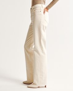 Our classic relaxed jeans in a neutral bone wash with a raw hem. This fit features a 10.5” high rise, is fitted at the waist and hips, and eases at the thigh into a relaxed, full-length leg shape. This jean is made from our vintage stretch fabric which features both an authentic vintage look and contains slight built-in stretch for additional comfort. Casual Cream Cotton Flare Jeans, Cream Straight Leg Jeans For Fall, Cream Cotton Flare Jeans, Wide Leg Flare Jeans In Beige With Five Pockets, Casual Neutral Jeans With Five Pockets, Beige Wide Leg Denim Jeans, Cream Pants With Five Pockets For Fall, Cream Wide Leg Flare Jeans For Fall, Cream Wide-leg Flare Jeans For Fall