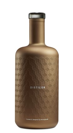 a brown bottle with the word distiller on it's side and a silver lid